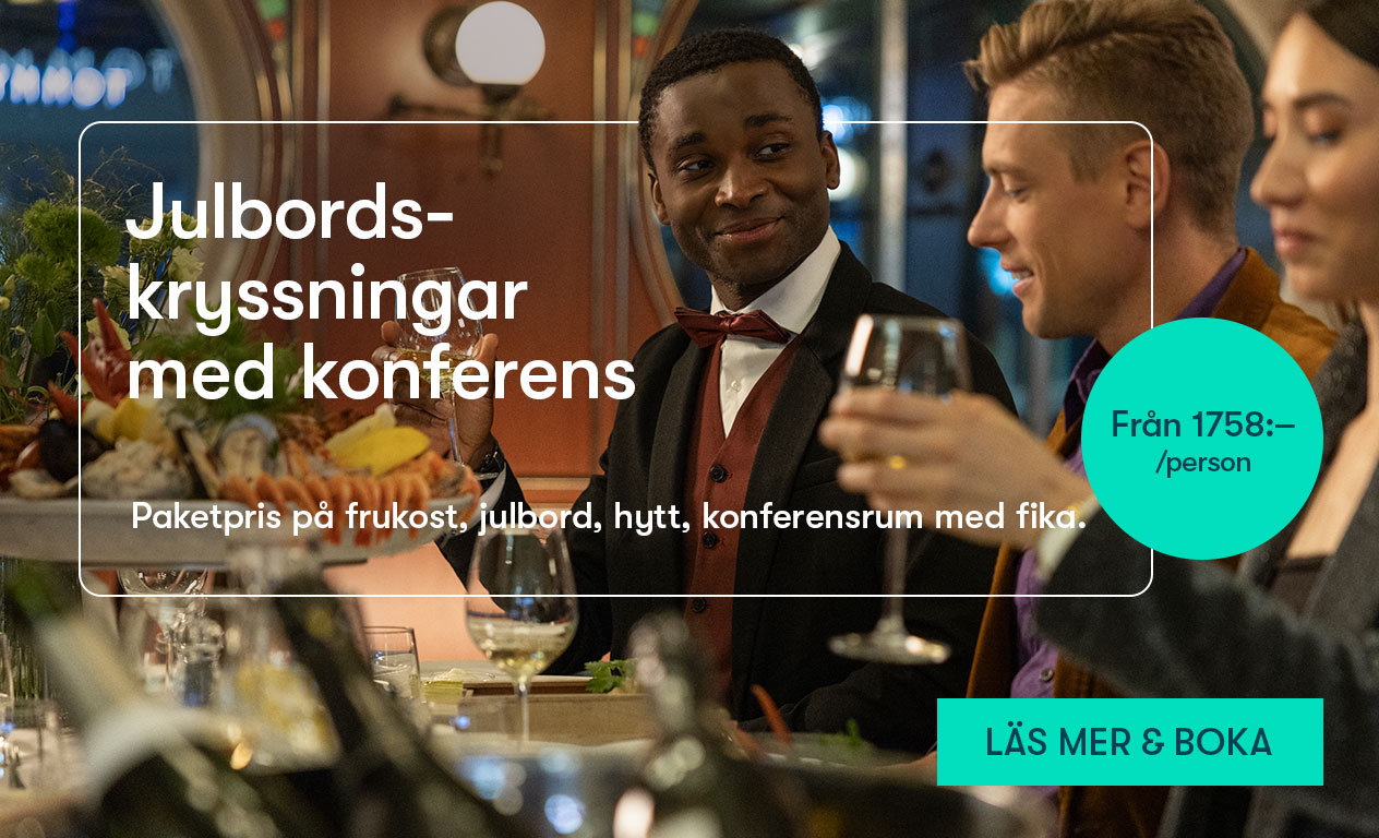 Ett gäng kollegor äter julbord tillsammans på konferenskryssning